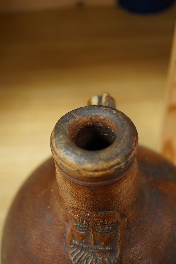 A Bellarmine stoneware jug, 17th century, 36cm high